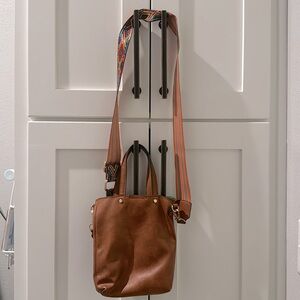 Small brown crossbody bag with double sided strap